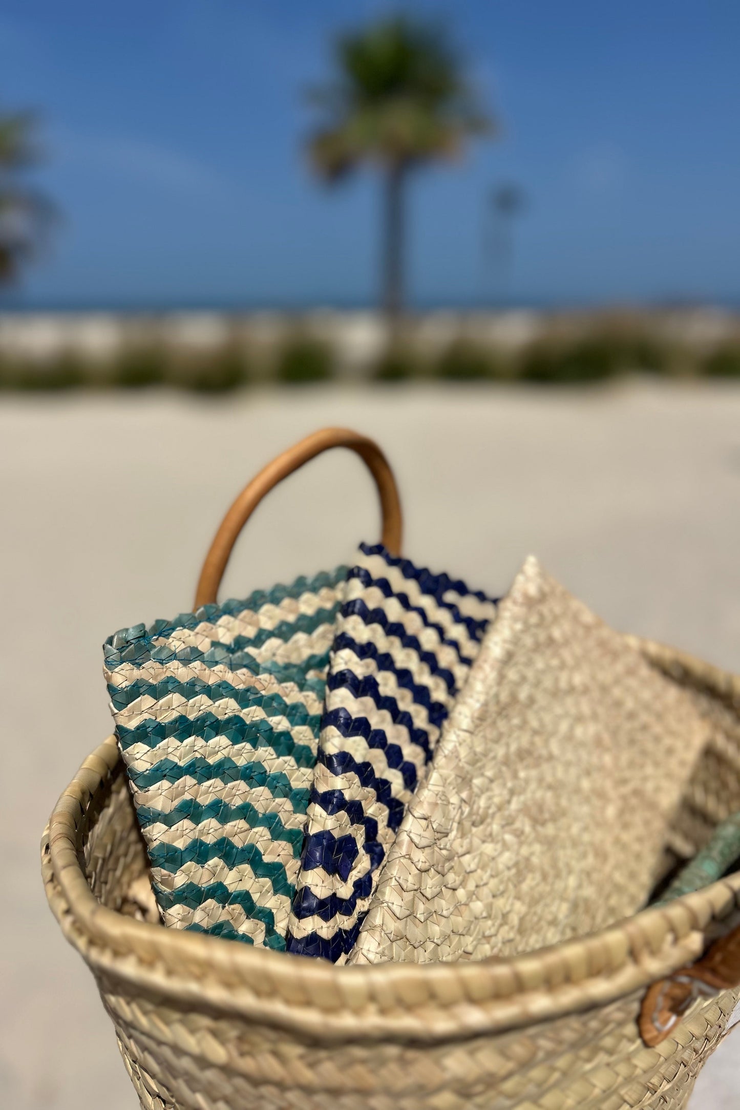 Palm woven envelope clutch bag