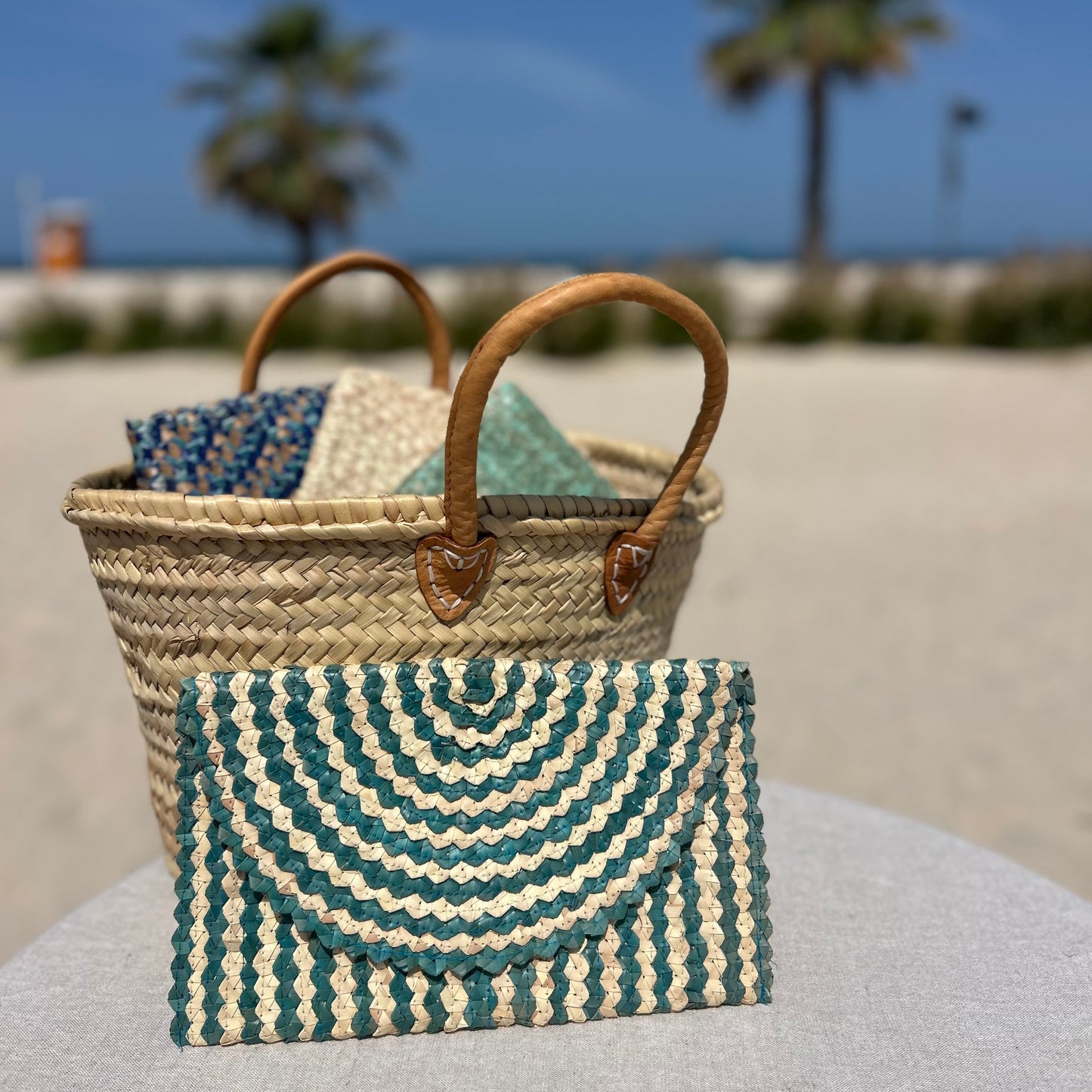 Woven clutch bag in green and cream
