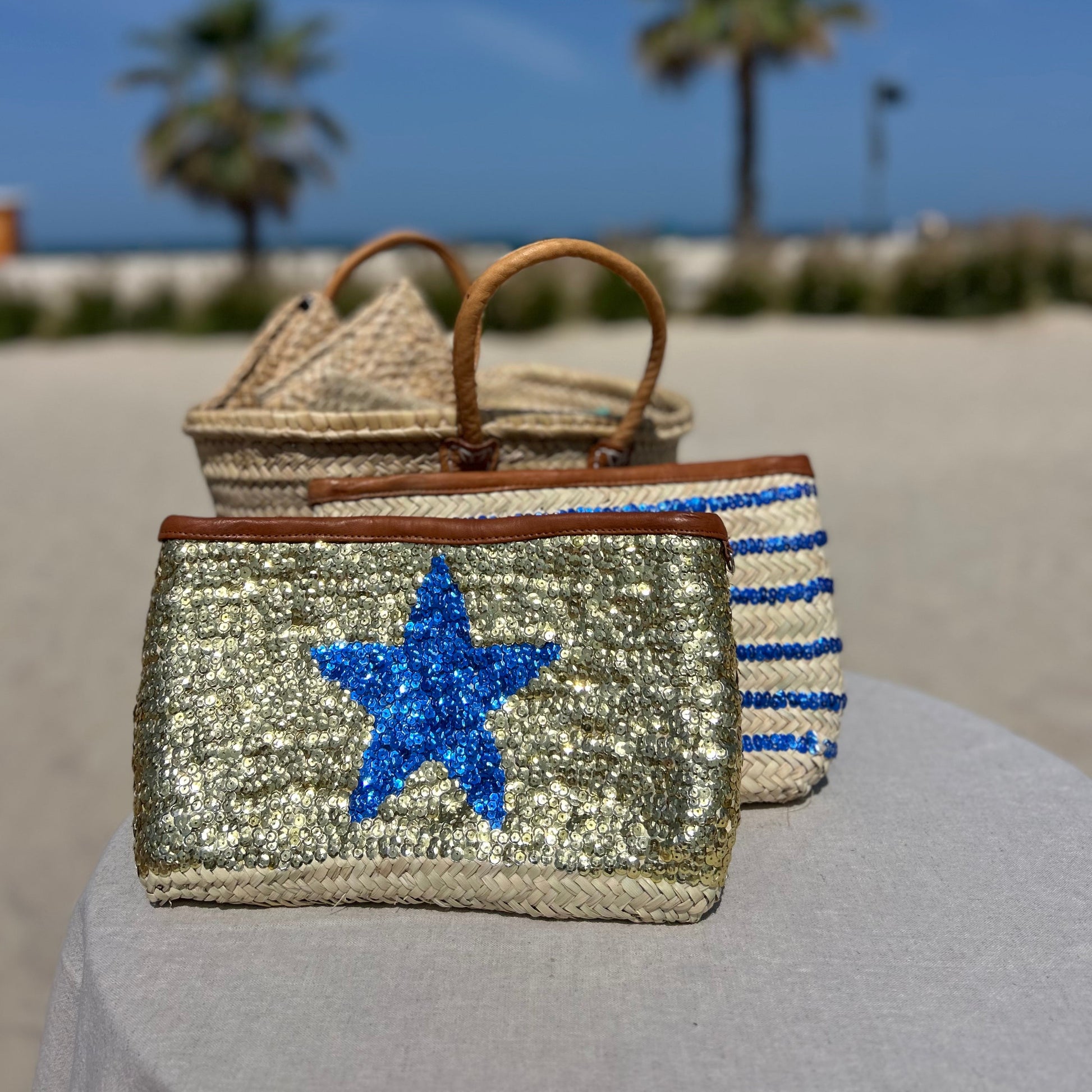 Hand made moroccan clutch bag with gold sequins and blue star. Tan leather trim and zip to close