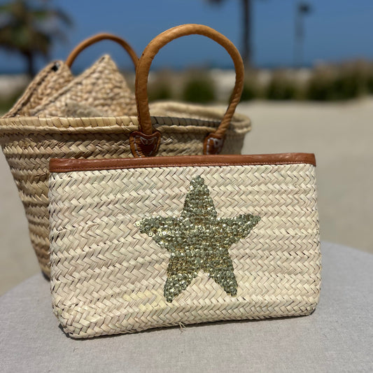 Natural palm woven clutch bag with sequin gold star and leather trim