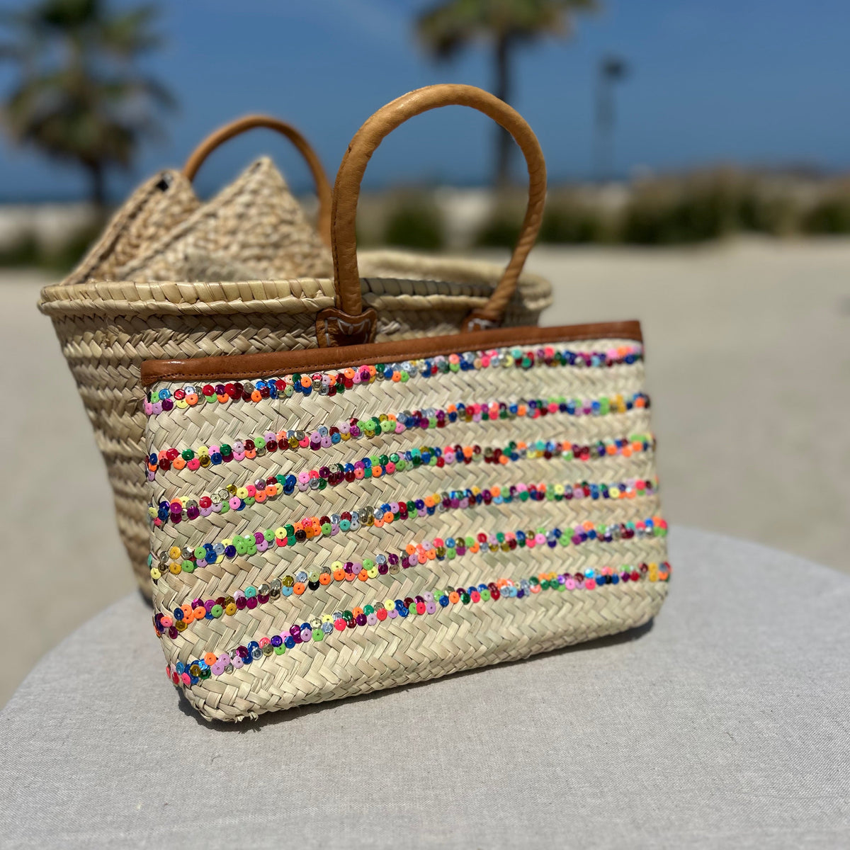 Hand made morroccan clutch bag with multi colour sequin stripe and trimmed with tan leather and zip to close