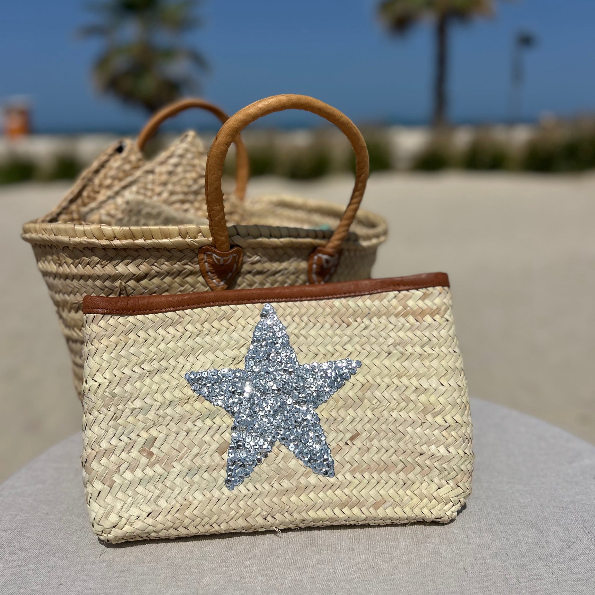 Natural palm Moroccan woven clutch bag with sequin silver star and leather trim and zip fastener